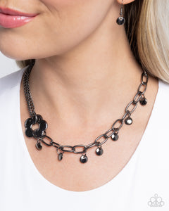 Magic Merger - Black Necklace - Paparazzi Accessories